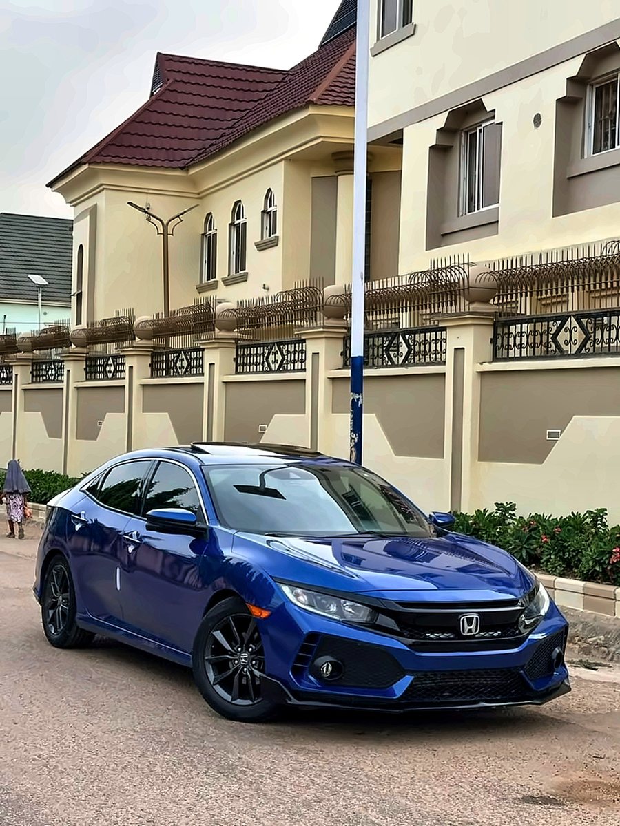2020 Honda Civic Sport in blue, front three-quarter view